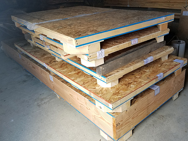 Stack of four custom made crates for shipping live edge slabs and burls